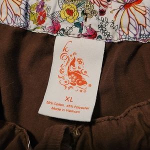 Scrub bottoms. KOI brand. Size XL.  One brown One Purple.